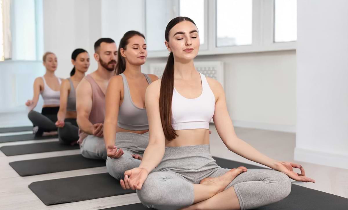 Group of people practicing yoga in a studio