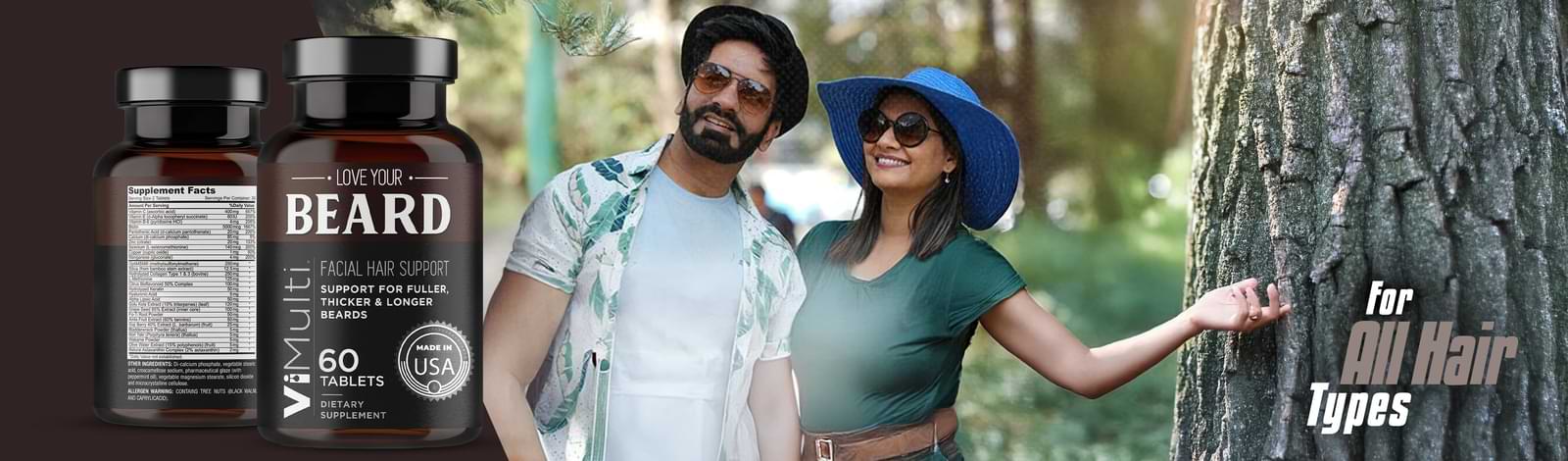 Two people standing outdoors with bottles of a beard product in the foreground.